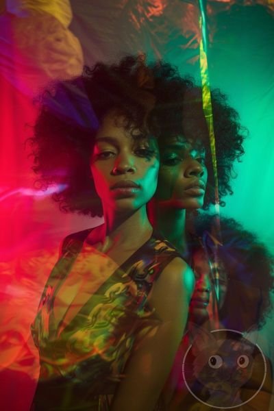lallen_three_women_some_of_whom_look_like_they_have_afros_stand_e743f5ff-3d7a-4d0f-a507-9728940169ad