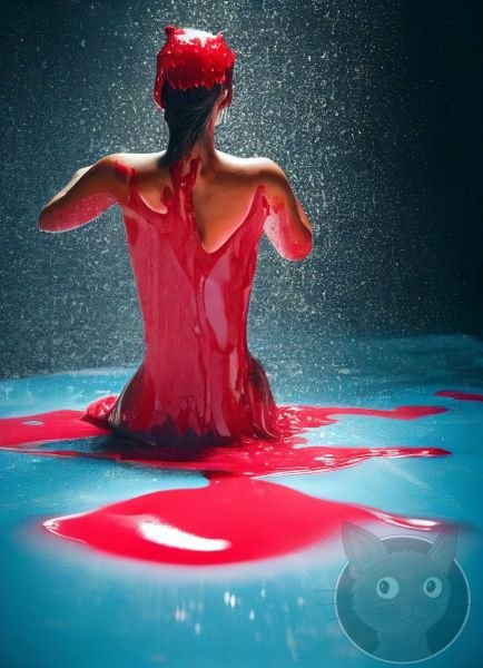 lallen_woman_kneeling_in_a_pool_of_red_liquid_splashes_dripping_b32f4862-03ca-4c83-ba4e-f8f95678c04e